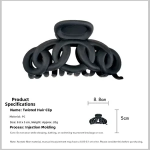 Macro shot of 8.8cm matte black twist hair claw clip with detailed size measurements