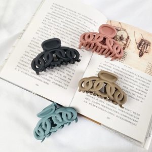 Set of 4 matte French twist hair claws in black, pink, olive green, and mist blue