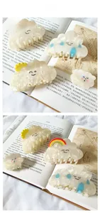 Close-up of acetic acid cloud hair claws with pearlescent finish and cute facial expressions