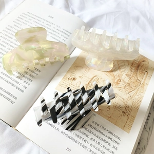 Three elegant 9cm acetate shark hair claws in pearl white, aurora green and zebra pattern