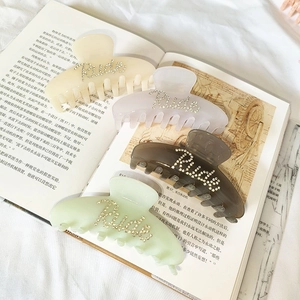 Set of four large acetate shark hair claws with Rich rhinestone lettering in pastel colors
