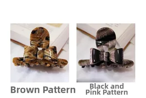 Detailed close-up of acetate bow hair clips in tortoiseshell and black-pink patterns