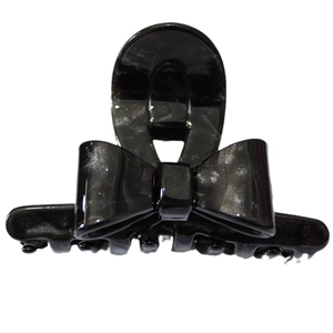 Elegant black acetate bow hair claw clip with silver glitter finish for women's updos