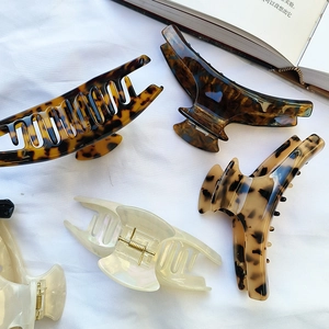 French style large acetate hair claws in tortoise shell, amber, and pearl white colors
