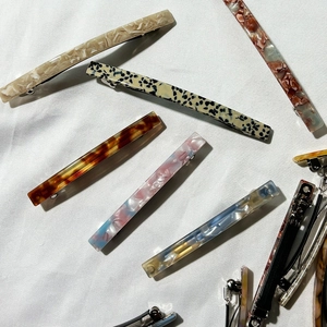 French minimalist acetate hair clips with diverse marble and tortoiseshell patterns