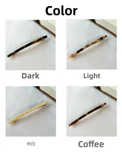 Detail view showing four variants of slim french hair clips with acetate marble patterns