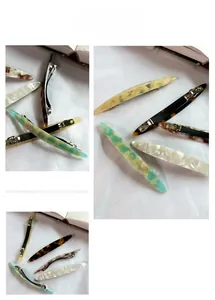 Close-up of leopard acetate hair clip showing the durable metal spring base and smooth finish