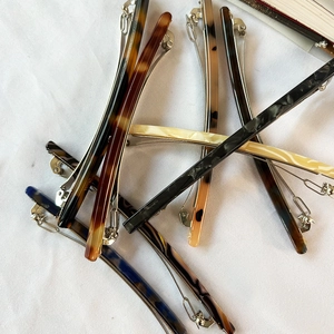 French minimalist acetate hair clips in tortoiseshell and marble patterns with metal spring