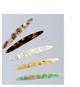 Detail view of acetate leopard print hair clips in various tortoiseshell patterns