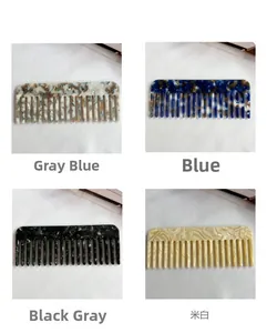 Detail showing four marble acetate wide-tooth combs in grey, blue, black, and cream colors