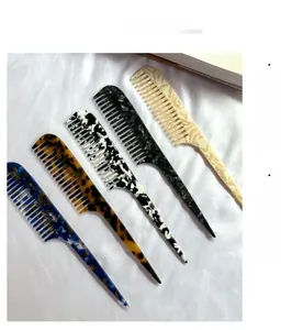 Close-up of stylish acetate hair combs in five marble and tortoise shell patterns