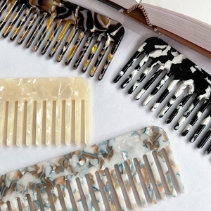 Elegant wide-tooth acetate hair combs with vintage tortoiseshell and marble patterns