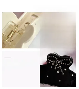Detail view of acetate bow hair claw clip with rhinestones and metal spring mechanism