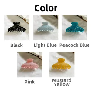 Five assorted colors of acetate shark hair clips with starry moon glitter patterns