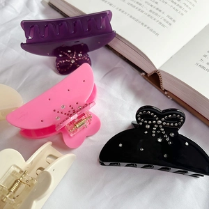 Elegant bow-shaped acetate hair claw clips with rhinestones in four assorted colors