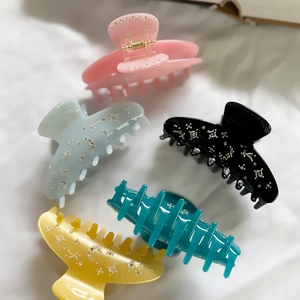 Set of four French vintage starry acetate hair claws with rhinestones and moon patterns