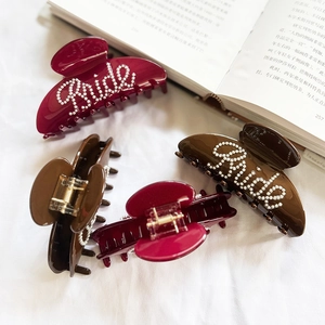 Elegant four-piece pearl bride hair claw clip set in burgundy and dark brown resin