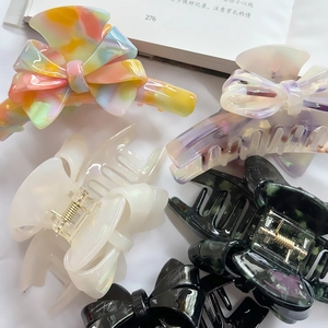 French acetate bow hair claw clips in marble and pearl finishes for thick hair