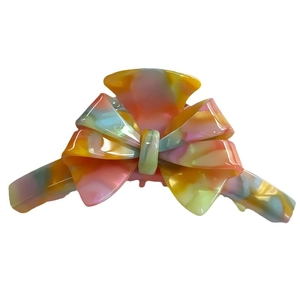 French bow claw clip with colorful marble texture and glossy finish for women