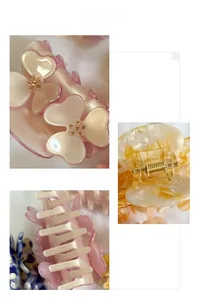 Detailed view of floral acetate claw clips with sparkling rhinestones and marble patterns