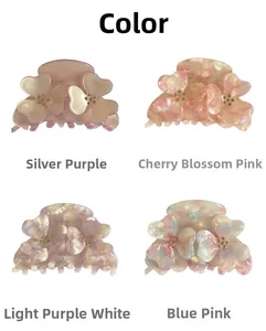 Macro view of floral hair clips with acetate marble texture and crystal rhinestones