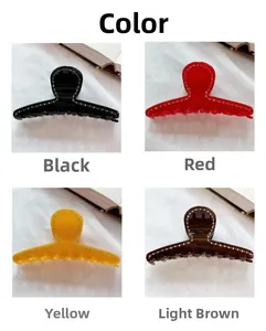 Detail of elegant hair claw clips in black, red, yellow and tan with rhinestone trim