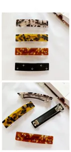 Detail view of acetate spring hair clips with star rhinestones in four elegant colors
