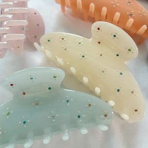 French star rhinestone acetate hair claw clips in pastel pink, orange and mint colors