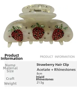 Detail view of 8cm acetate strawberry hair claw clip with colorful rhinestones inlay