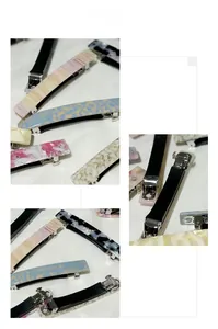Detailed macro view showing diverse acetate patterns and secure silver metal spring clip