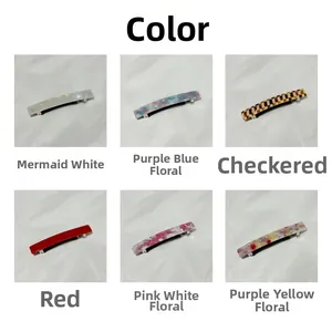 Detail view of small rectangular acetate hair clips in various floral and plaid patterns