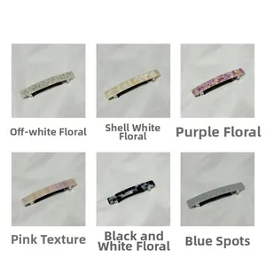 Macro shot of rectangular acetate spring hair clips in six distinct floral and marbled patterns