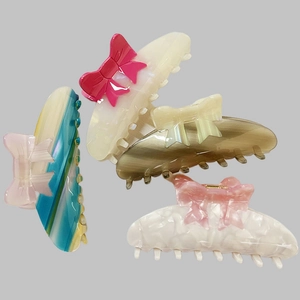 Set of four French acetate bow hair claws with iridescent pearlescent finish colors