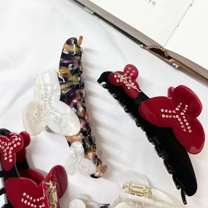 Floral acetate hair claw clips with rhinestones in marble and tortoiseshell patterns