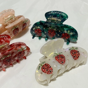 Acetate strawberry claw clips with rhinestones in pink, green, red and white colors