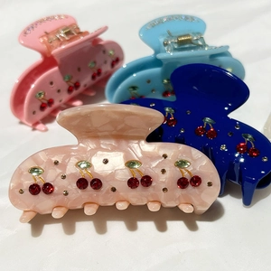 Elegant cherry rhinestone hair claw clips set in pink, blue and marble resin finish