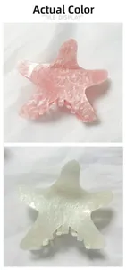 Detail showing pink and cream starfish hair claw clips with glitter resin texture