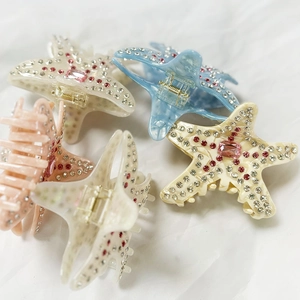Eleganti mollette per capelli a stella marina con strass in crema, azzurro e arancione
