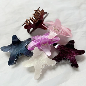 Starfish hair claw clips in various marbled colors for summer beach hair styling