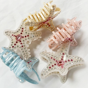 Molle per capelli a stella marina con strass in crema, rosa, blu e ambra colori