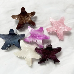 Starfish hair claw clips in six vibrant colors with a pearlescent finish for summer style