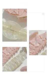 Détail de la pince à cheveux papillon rose avec strass et barrette crème nacrée