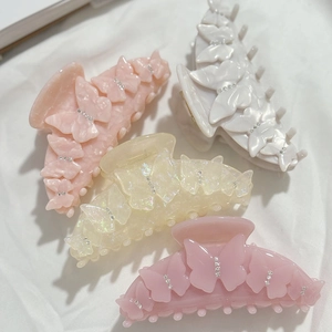 Pinces à cheveux papillon élégantes en acétate marbré avec strass brillants décoratifs