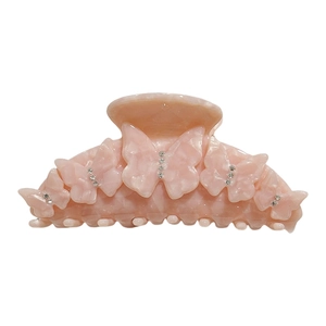Pince à cheveux en acétate rose avec papillons et strass avec texture marbrée