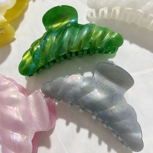Elegant wave-edge large shark hair claw clips in assorted pearlescent acetate colors