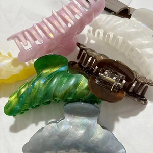 Elegant large cellulose acetate hair claw clips in various pearlescent marble colors