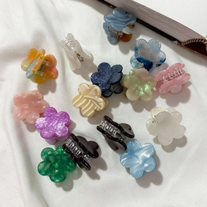 Set of 14 colorful mini flower hair claws in acetate and marble textures for women