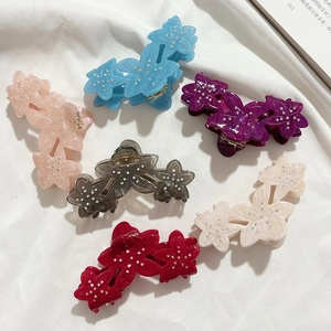 Set of six colorful flower acetate hair claws with sparkling rhinestone accents