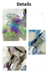 Detailed view of butterfly hair claw clip with purple gradient acetate and metal spring