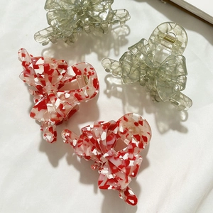 Eleganti mollette per capelli a fiocco in acetato rosso marmorizzato e verde salvia